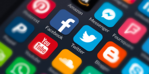 A close up of multiple social media icons on a black background