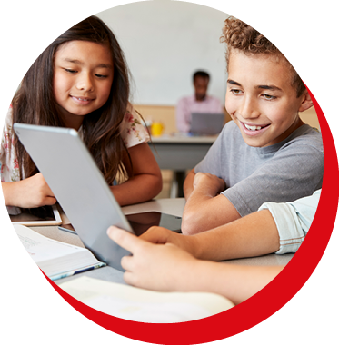 A male and a female student sitting in front of a computer inside a circle and a partial red outline on the bottom right